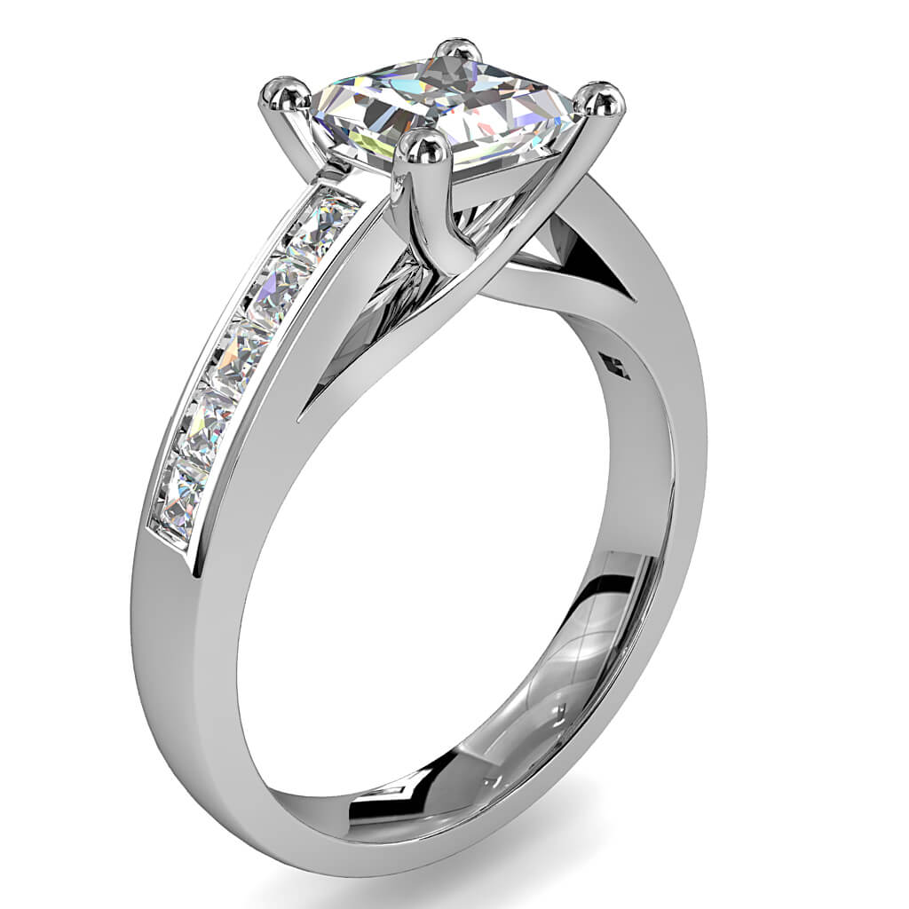 Princess Cut Solitaire Diamond Engagement Ring, 4 Claw Set on a Channel Set Band and an Undersweep Setting.