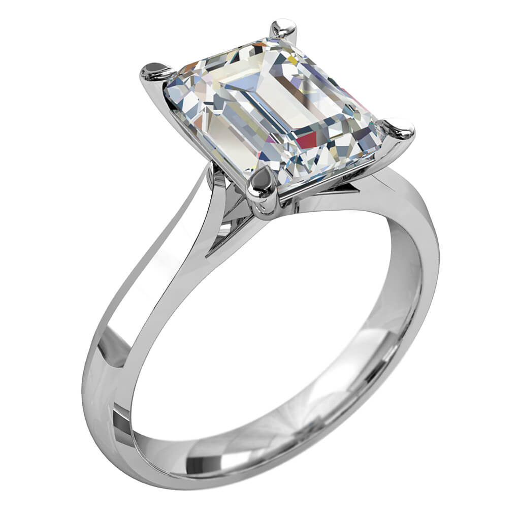 Emerald Cut Solitaire Diamond Engagement Ring, 4 Pear Shape Claws Set on a Tapered Knife Edge Band with Undersweep Setting.