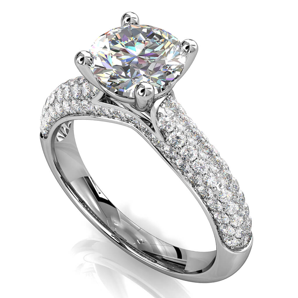 Cushion Cut Solitaire Diamond Engagement Ring, 4 Claw Set on Rolled Pave Band with an Undersweep Setting.