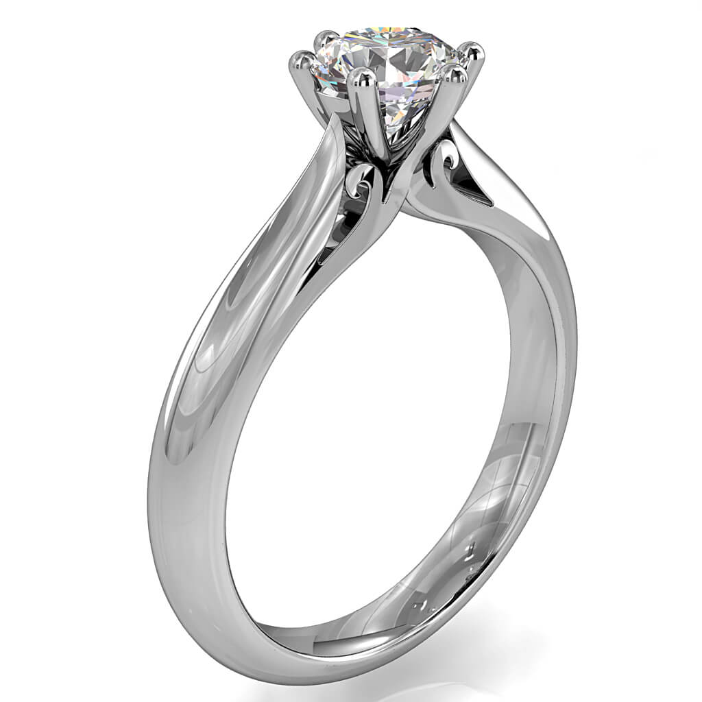 Round Brilliant Cut Solitaire Diamond Engagement Ring, 6 Button Claws on a Tapered Knife Edge and Rounded Band with Scroll Undersetting.
