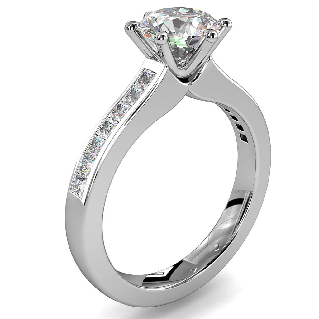 Round Brilliant Cut Solitaire Diamond Engagement Ring, 6 Pear Shaped Claws on Princess Cut Channel Set Band with Classic Undersetting.