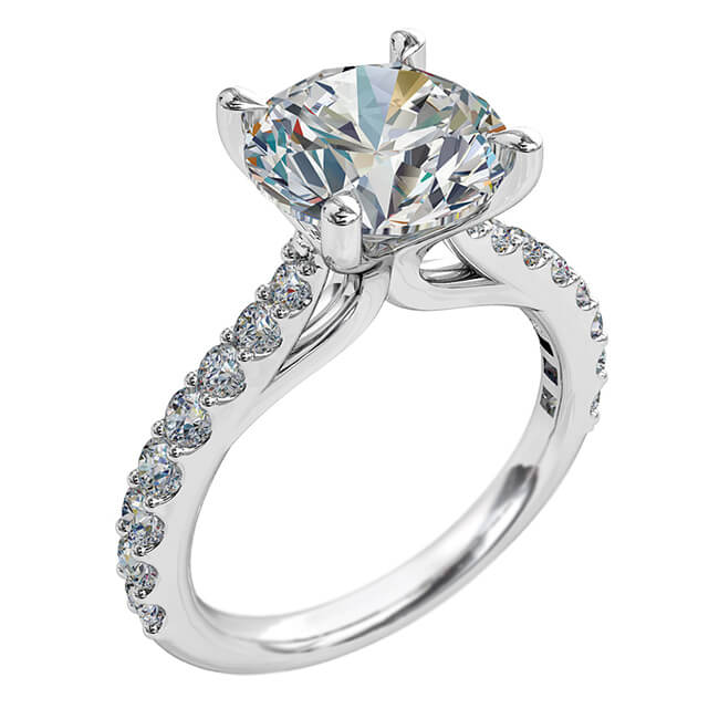 Round Brilliant Cut Solitaire Diamond Engagement Ring, 4 Pear Shaped Claws Set on a Tapered Cut Claw Band with Fountain Undersetting.